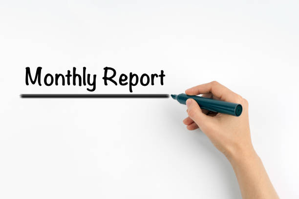istock Monthly Report. Hand with marker writing on a white background 813319824