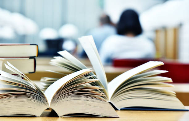 istock Books lying on the table in the public library 813320594