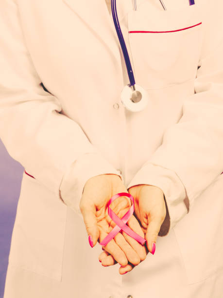 istock Female hands with pink ribbon 813321218
