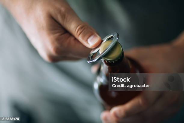 Opening A Beer Stock Photo - Download Image Now - Beer - Alcohol, Beer Bottle, Bottle Opener