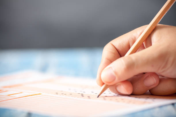 istock Hand on pencil choosing the test list on the examination 813343600