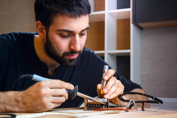 Electrician soldering wires