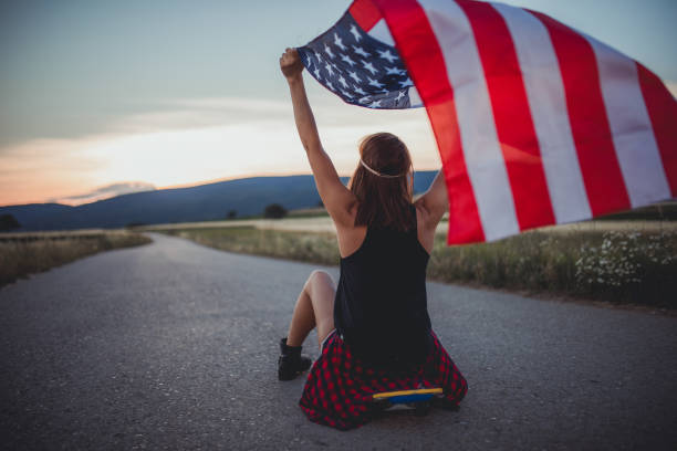 istock Girl skater with US flag 813348746