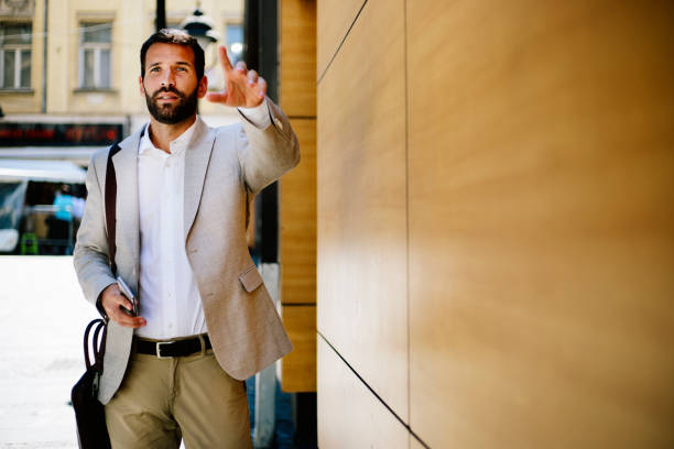 istock Businessman calling taxi 813351260