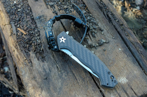 istock Folding knife and military watch. 813362938
