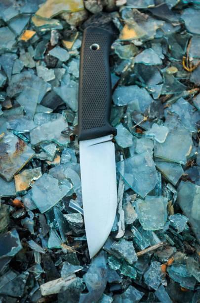 istock Outdoor knife. Background colorful. Glass. Vertical position. 813363144