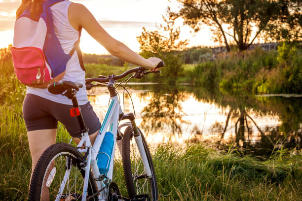 istock Bicyclist looking at the river 813365818