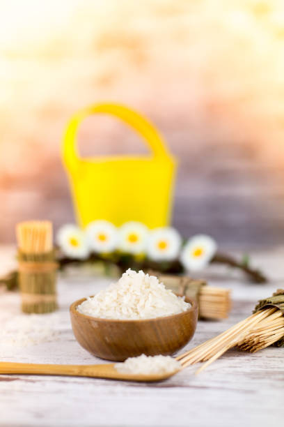 istock Rice, toothpicks and wooden spoon. Vintage boards. Selective focus. 813366570