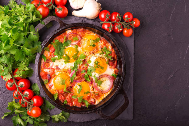 istock Shakshuka. Traditional Israeli cuisine. Fried eggs with vegetables 813372416