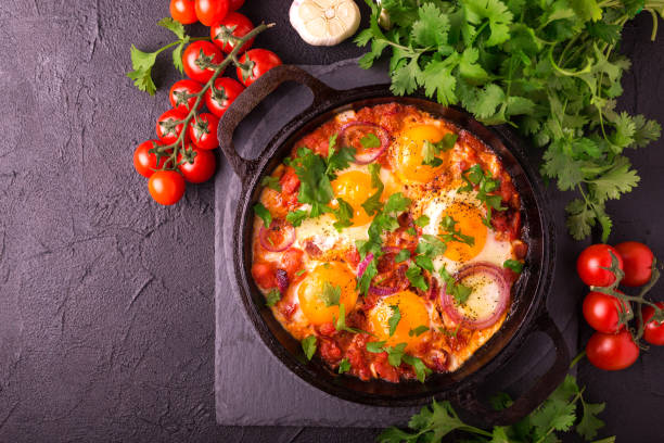istock Shakshuka. Traditional Israeli cuisine. Fried eggs with vegetables 813372540