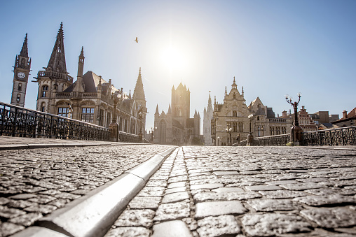 Beautiful view on the old town from saint Nicholas bridge during the sunrise in Gent city, Belgium