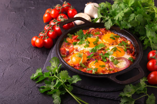 istock Shakshuka. Traditional Israeli cuisine. Fried eggs with vegetables 813372774