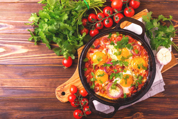 istock Shakshuka. Traditional Israeli cuisine. Fried eggs with vegetables 813372836