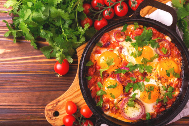 istock Shakshuka. Traditional Israeli cuisine. Fried eggs with vegetables 813372962