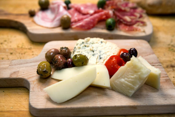istock Two Plates with Ham, Salami and Prosciutto and Cheese 813376188