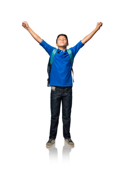 istock Latin boy standing and raising his arms 813380360