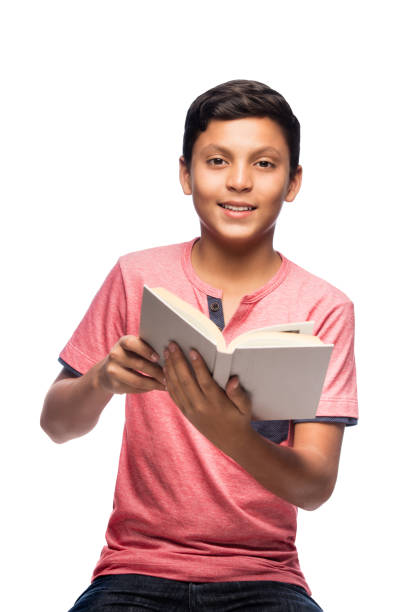 istock Happy latin boy holding a book and looking at camera 813381004