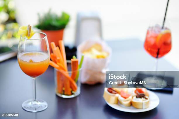Italian Aperitives Aperitif Two Glasses Of Cocktail And Appetizer Platter On The Table Stock Photo - Download Image Now