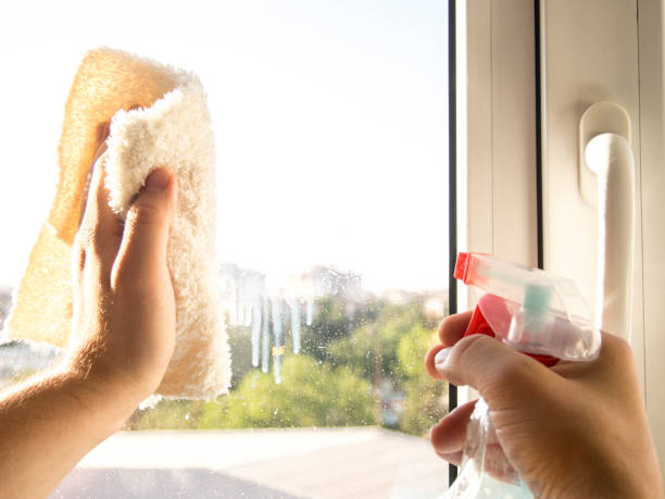 istock Cleaning glass with spray and cloth 813404678
