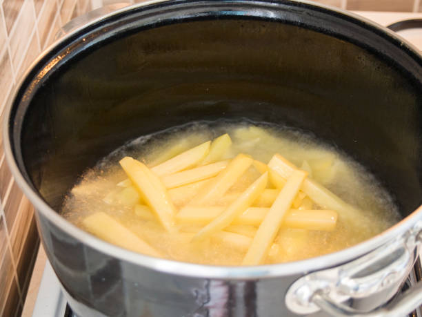 istock French fries in a frying pan 813404864