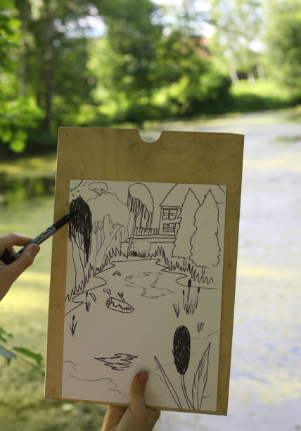 istock hand make draft sketch of pond lake in the forest 813409134