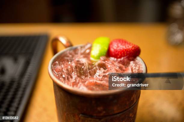Vodka Moscow Mule With Lime And Strawberry Stock Photo - Download Image Now - Moscow Mule, Moscow - Russia, Mule