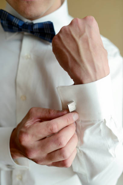 istock Groom is wearing cufflinks indoors 813413952