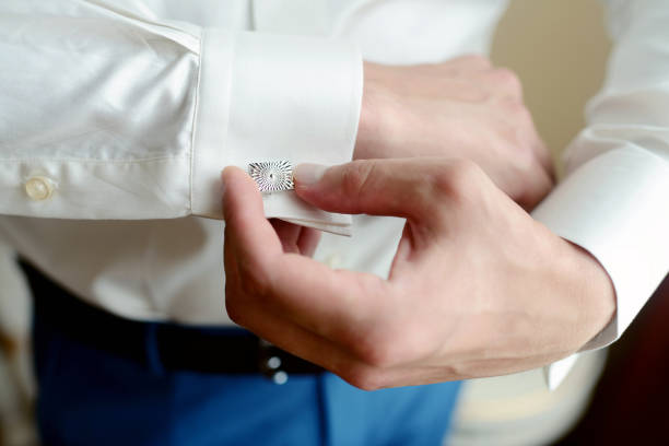 istock Groom is wearing cufflinks indoors 813414014