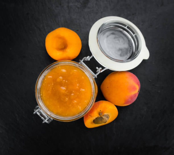 istock Portion of Apricot Jam on a slate slab 813416572