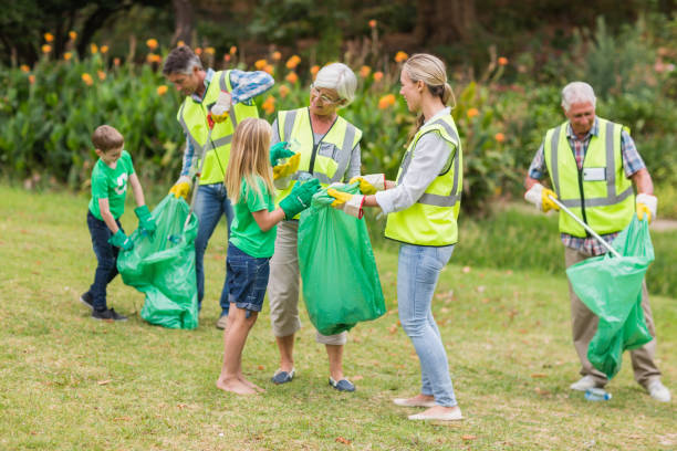 istock Happy family collecting rubbish 813428044