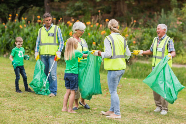 istock Happy family collecting rubbish 813428114