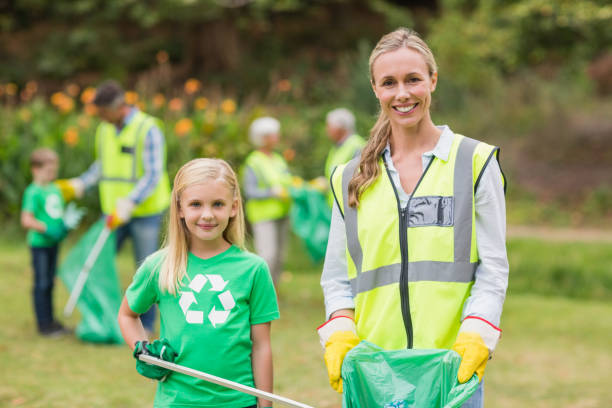 istock Happy family collecting rubbish 813428186