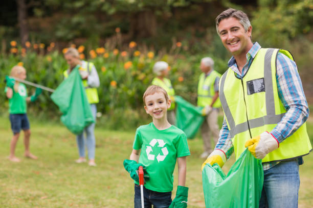 istock Happy family collecting rubbish 813432330