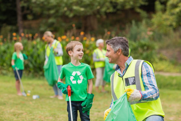 istock Happy family collecting rubbish 813434370
