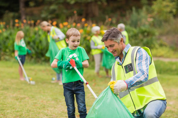 istock Happy family collecting rubbish 813434450