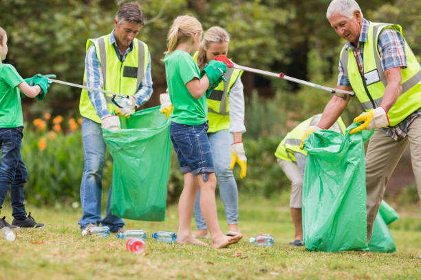 istock Happy family collecting rubbish 813434638