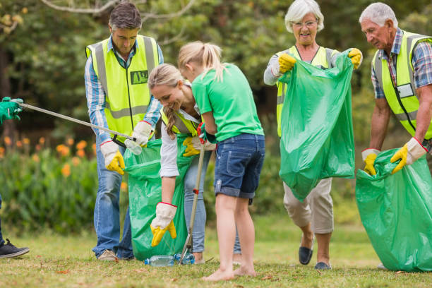 istock Happy family collecting rubbish 813434716