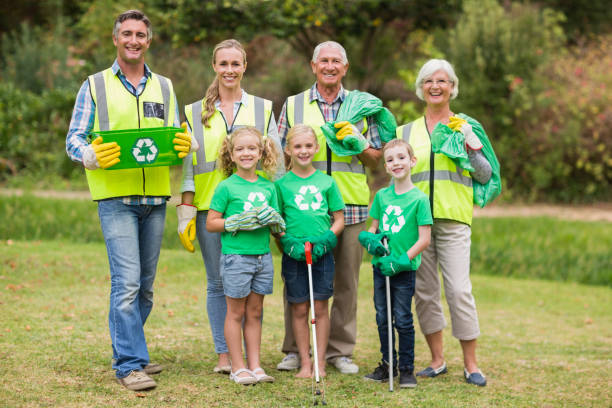 istock Happy family collecting rubbish 813434738