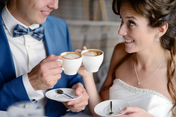 istock Wedding couple indoors is drinking coffee 813436948