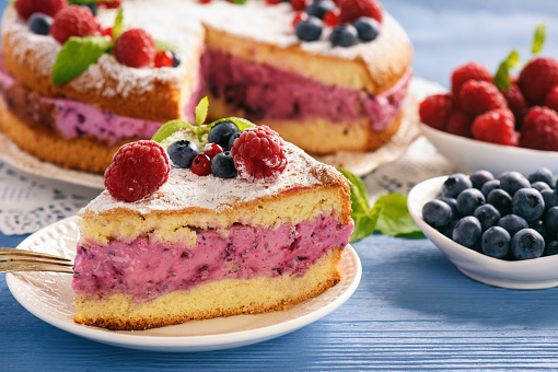 Delicious homemade cake with berry cheese cream.