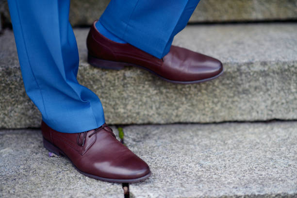 istock Groom is wearing shoes indoors 813442084