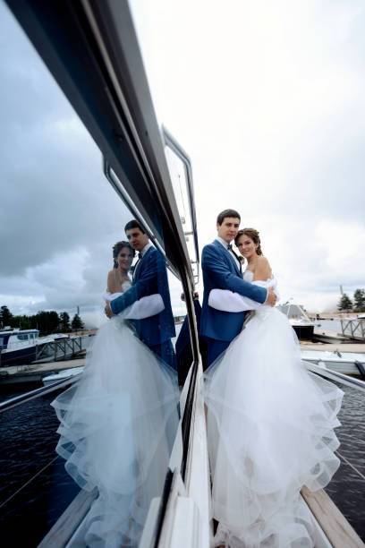 istock Wedding couple is hugging on a yacht 813446792