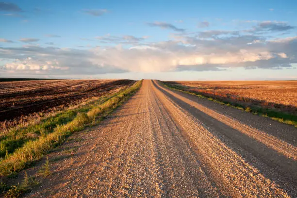 Early morning image of a lonely prairie road, Saskatchewan, Canada. Image taken from a tripod.