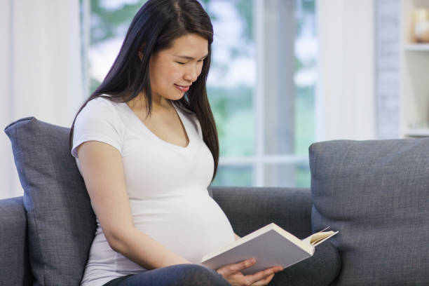istock Pregnant Woman Reading 813452254