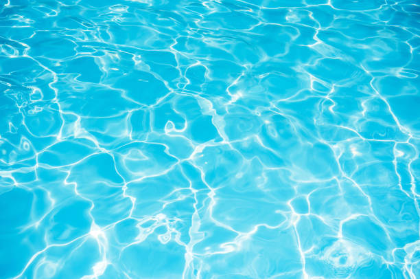istock Blue water surface in swimming pool for background 813452544