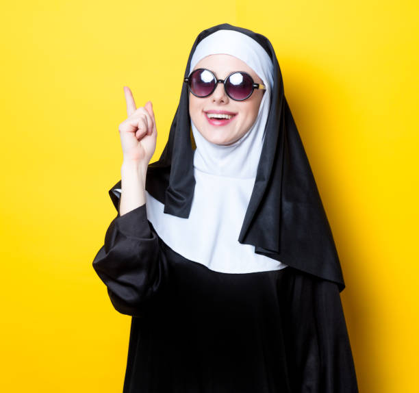 istock Young happy nun with sunglasses 813453034