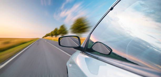 istock A view from behind the steering wheel of a car 813455788