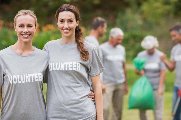 istock Happy volunteer collecting rubbish 813455798