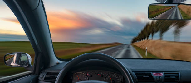 A view from behind the steering wheel of a car
