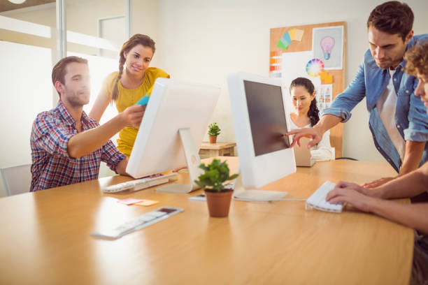 istock Attentive business team working on laptops 813460330